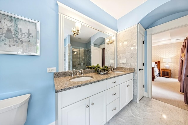16 Tuttle Ave, Clarendon Hills, IL 60514 - ensuite bathroom featuring double vanity, toilet, a shower stall, and marble finish floors
