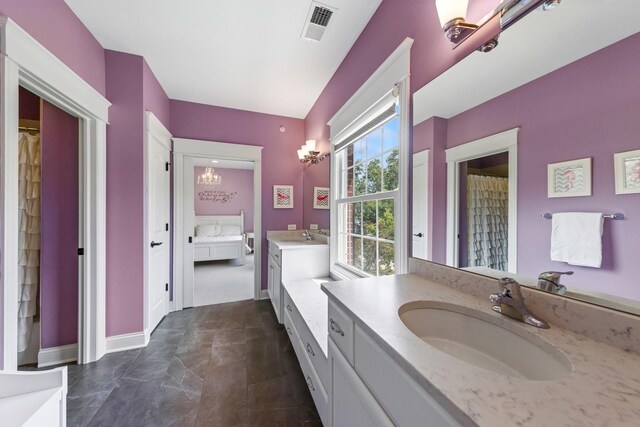 16 Tuttle Ave, Clarendon Hills, IL 60514 - full bath featuring vanity, ensuite bathroom, a chandelier, and baseboards