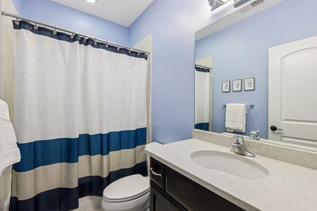 16 Tuttle Ave, Clarendon Hills, IL 60514 - bathroom featuring vanity, toilet, and curtained shower