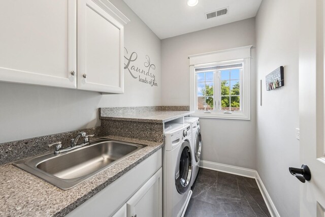 16 Tuttle Ave, Clarendon Hills, IL 60514 - washroom with washer and clothes dryer, dark marble finish flooring, baseboards, and cabinet space