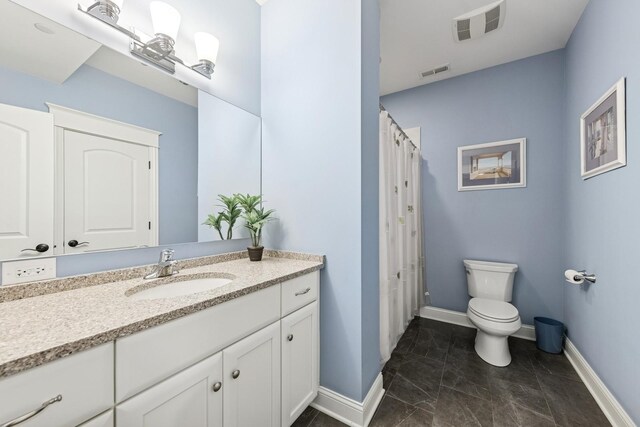 16 Tuttle Ave, Clarendon Hills, IL 60514 - full bath featuring vanity, baseboards, toilet, and marble look tiles