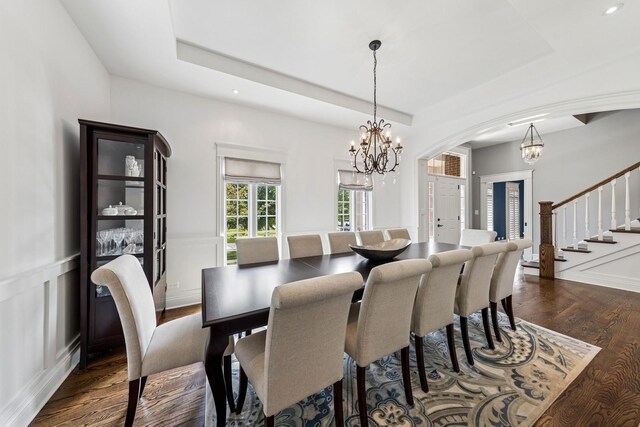 16 Tuttle Ave, Clarendon Hills, IL 60514 - dining room featuring a chandelier, dark wood-type flooring, a raised ceiling, stairs, and recessed lighting