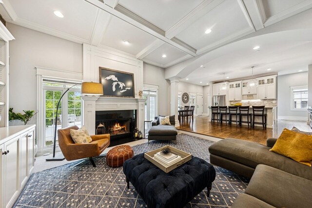 16 Tuttle Ave, Clarendon Hills, IL 60514 - living room featuring ornate columns, beam ceiling, a lit fireplace, recessed lighting, and arched walkways