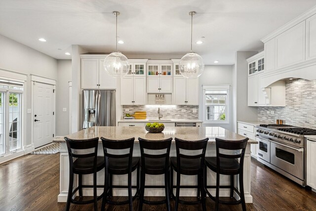 16 Tuttle Ave, Clarendon Hills, IL 60514 - kitchen featuring stainless steel appliances, a sink, backsplash, white cabinets, and recessed lighting