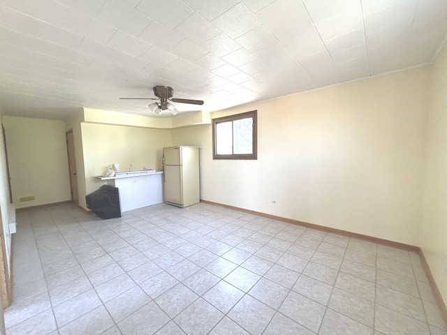 7951 S Kolin Ave, Chicago, IL 60652 - unfurnished living room featuring ceiling fan, light tile patterned floors, and baseboards