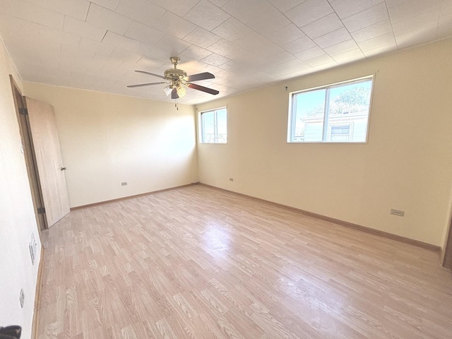 7951 S Kolin Ave, Chicago, IL 60652 - empty room featuring a ceiling fan, light wood-type flooring, and baseboards