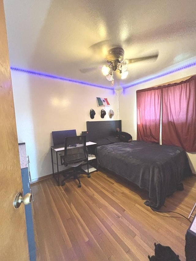 7951 S Kolin Ave, Chicago, IL 60652 - bedroom with wood finished floors, ceiling fan, and a textured ceiling