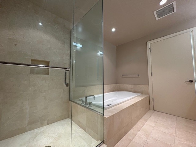 270 E Pearson St Unit 602, Chicago, IL 60611 - bathroom featuring a garden tub, a shower stall, tile patterned flooring, and recessed lighting