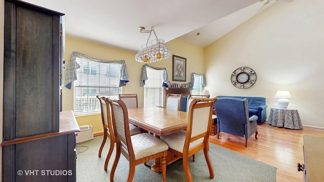1719 Westbridge Ct, Hoffman Estates, IL 60194 - dining room featuring light wood-style floors, lofted ceiling, and baseboards