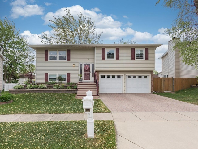 1415 W Stone Harbor Dr, Hoffman Estates, IL 60192 - split foyer home featuring decorative driveway and an attached garage