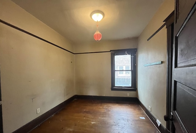 1825 S 6th St, Rockford, IL 61104 - spare room featuring dark wood-style floors and baseboards