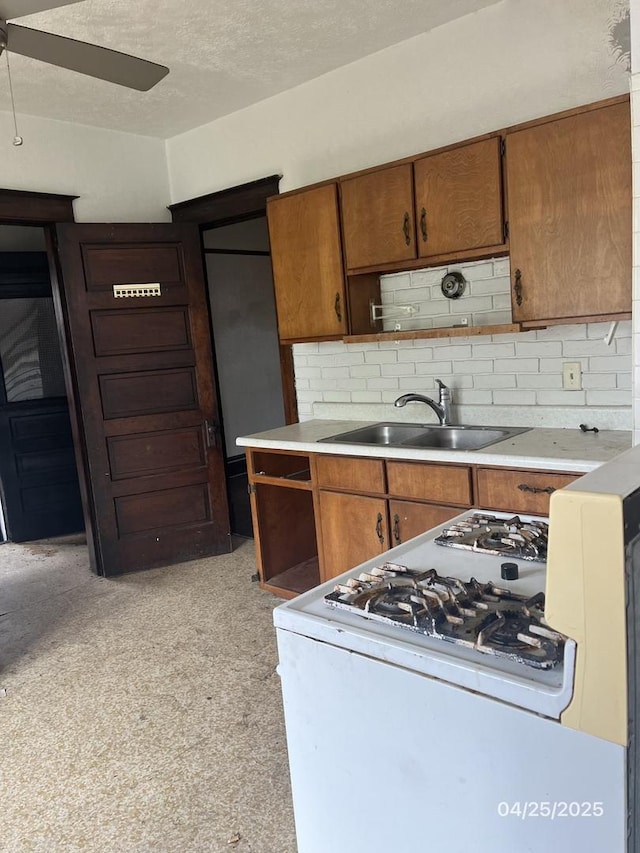 1825 S 6th St, Rockford, IL 61104 - kitchen featuring a sink, open shelves, range, a ceiling fan, and brown cabinetry