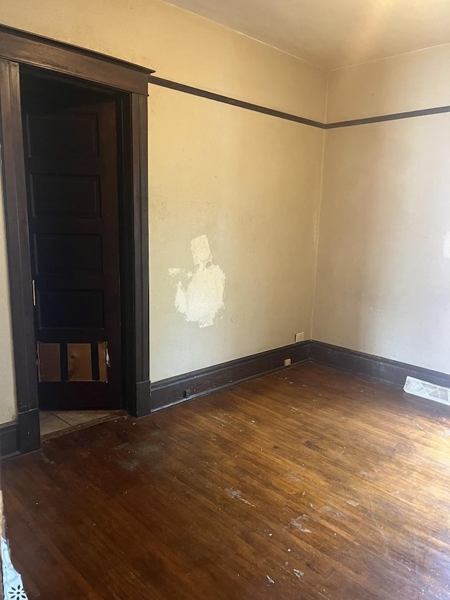 1825 S 6th St, Rockford, IL 61104 - unfurnished room with hardwood / wood-style flooring and baseboards