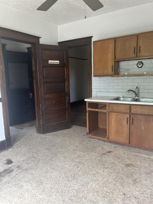 1825 S 6th St, Rockford, IL 61104 - kitchen featuring ceiling fan, a sink, open shelves, and a textured ceiling