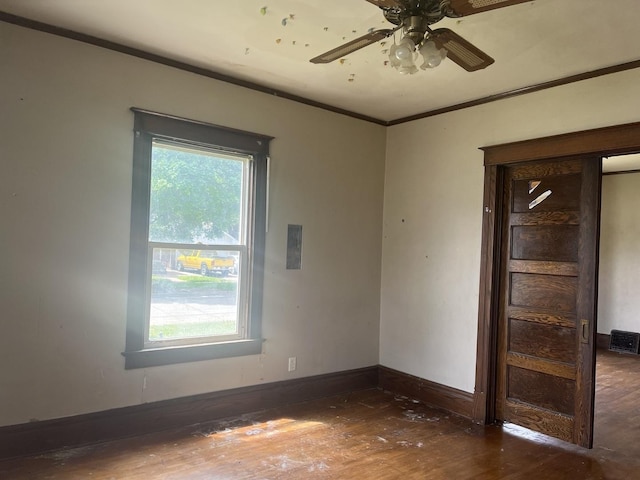 1825 S 6th St, Rockford, IL 61104 - unfurnished room featuring hardwood / wood-style floors, ornamental molding, ceiling fan, and baseboards