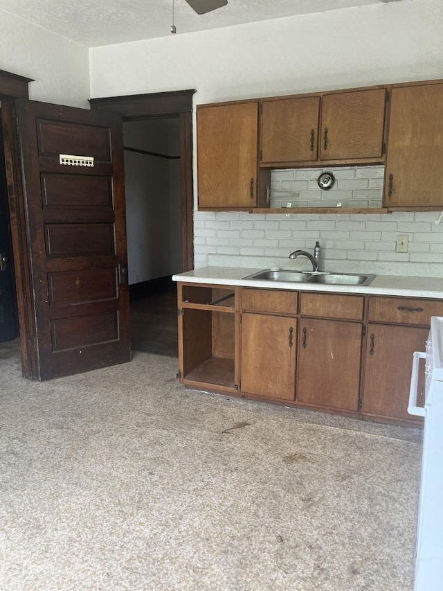 1825 S 6th St, Rockford, IL 61104 - kitchen with a sink, open shelves, light countertops, and decorative backsplash