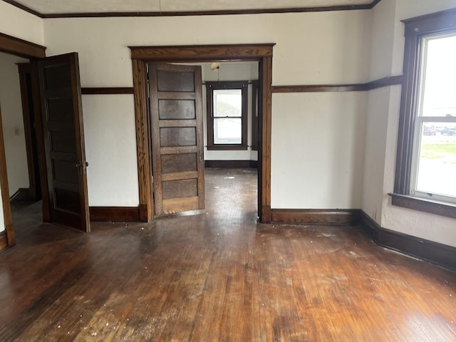 1825 S 6th St, Rockford, IL 61104 - empty room with hardwood / wood-style floors, plenty of natural light, and ornamental molding
