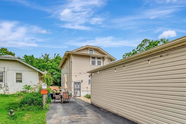 136 E 10th St, Chicago Heights, IL 60411 - back of house with a patio area and outdoor dining area