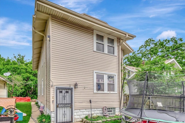 136 E 10th St, Chicago Heights, IL 60411 - back of property with a trampoline