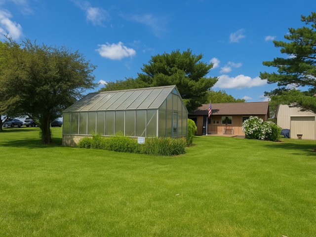 1975 W Minooka Rd, Morris, IL 60450 - view of grassy yard with an exterior structure, an outbuilding, and covered porch