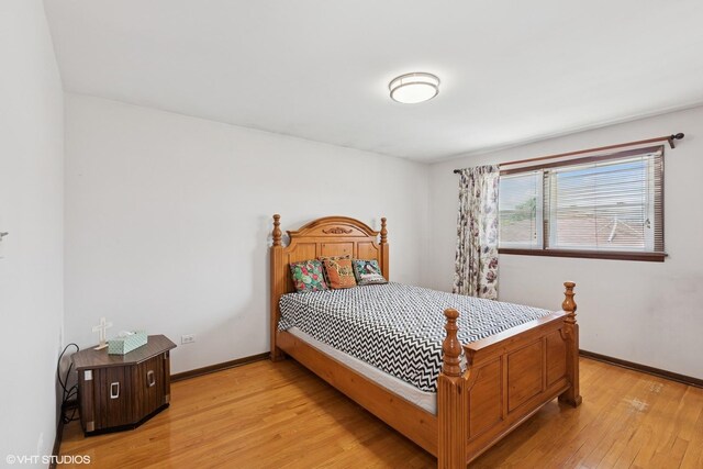 5738 W 88th St, Oak Lawn, IL 60453 - bedroom with light wood-type flooring and baseboards
