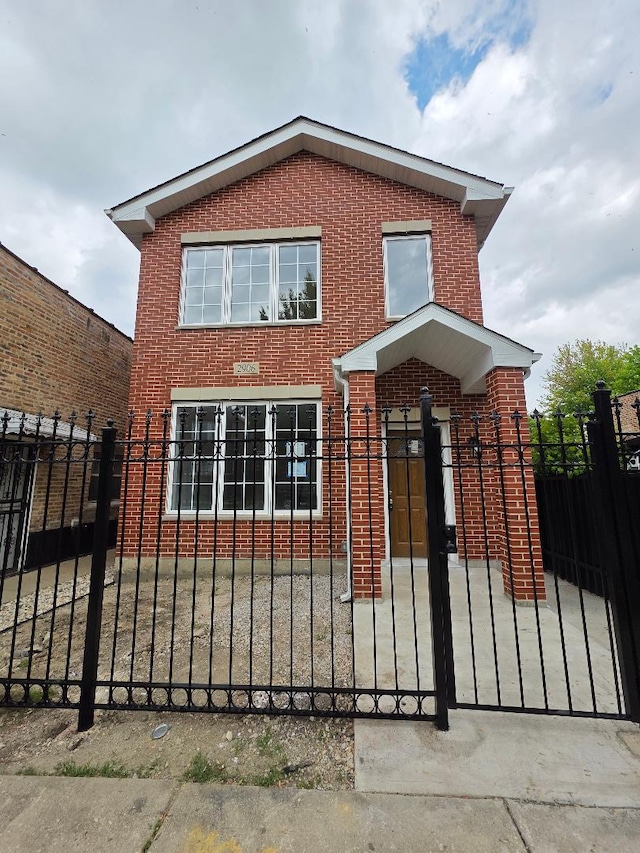 2906 W 40th St, Chicago, IL 60632 - view of front of house with brick siding, a fenced front yard, and a gate
