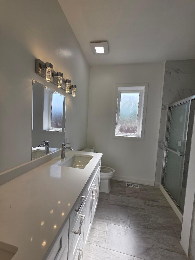 2906 W 40th St, Chicago, IL 60632 - full bathroom featuring double vanity, toilet, a shower stall, and baseboards