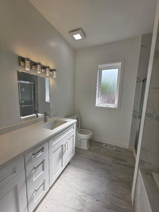 2906 W 40th St, Chicago, IL 60632 - bathroom with toilet, vanity, marble look tile flooring, a stall shower, and baseboards