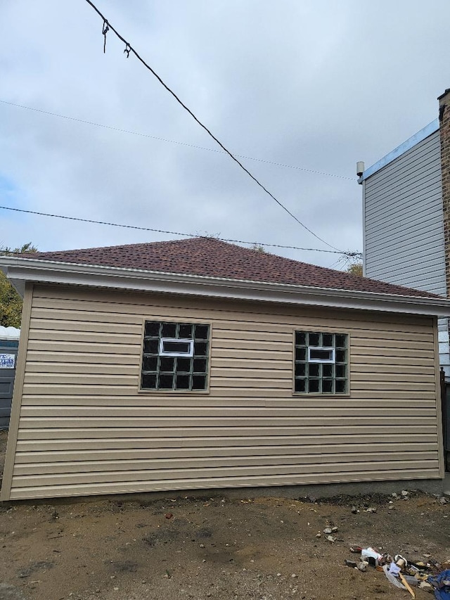 2906 W 40th St, Chicago, IL 60632 - view of side of property with a shingled roof