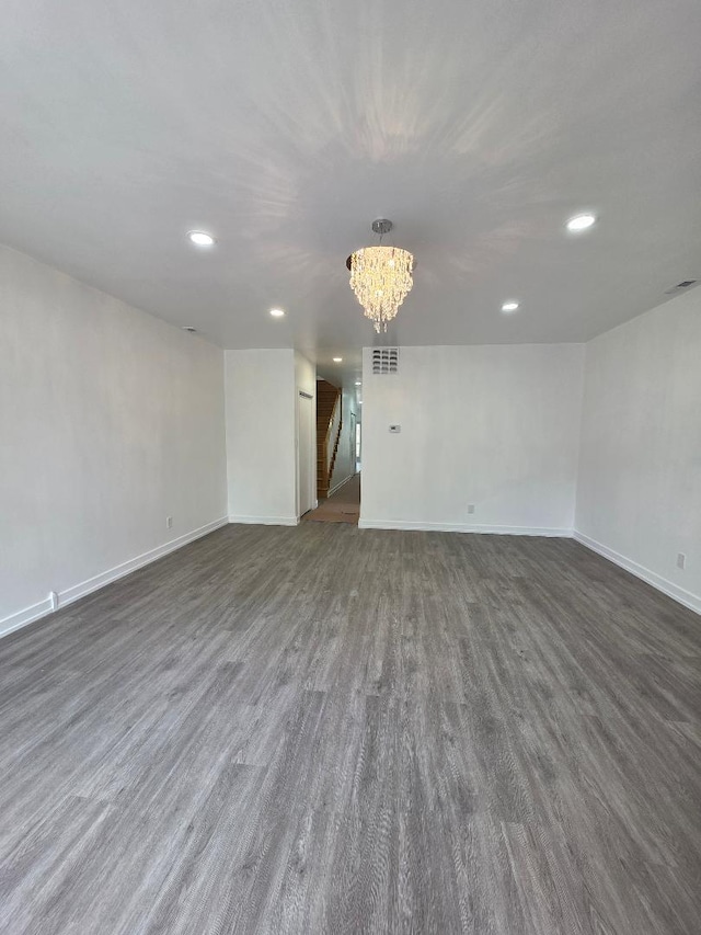 2906 W 40th St, Chicago, IL 60632 - unfurnished room featuring recessed lighting, a chandelier, baseboards, and dark wood-style flooring