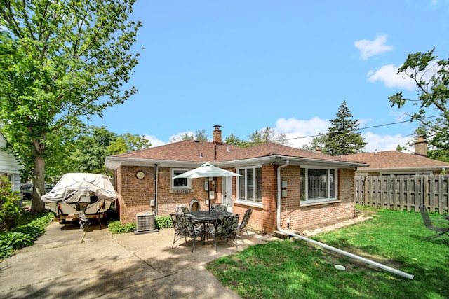 17601 Howe Ave, Homewood, IL 60430 - back of property with brick siding, a patio area, a chimney, and roof with shingles