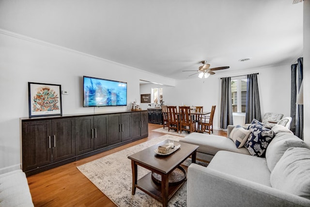17601 Howe Ave, Homewood, IL 60430 - living area featuring crown molding, light wood-style floors, and ceiling fan