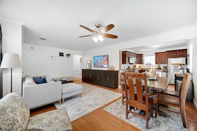 17601 Howe Ave, Homewood, IL 60430 - dining space with a ceiling fan, wood finished floors, and ornamental molding