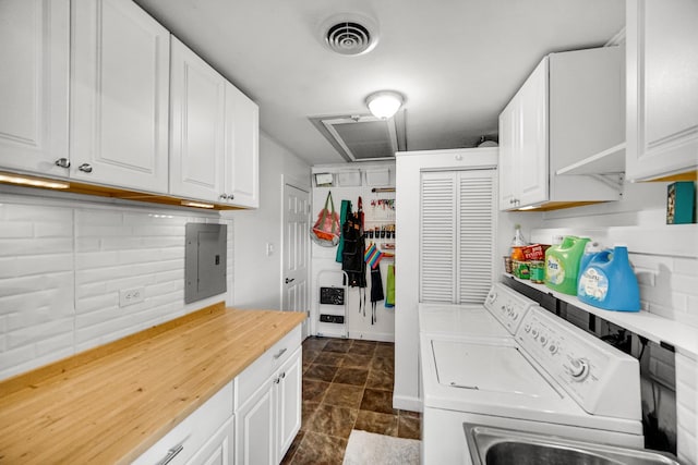 17601 Howe Ave, Homewood, IL 60430 - laundry room with washer and clothes dryer, electric panel, and dark stone finish floors