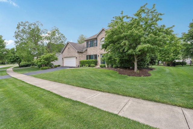 548 Asbury Dr, Aurora, IL 60502 - view of front of house featuring asphalt driveway, brick siding, and an attached garage