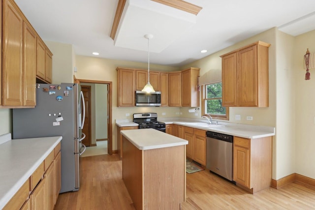 548 Asbury Dr, Aurora, IL 60502 - kitchen with stainless steel appliances, a sink, a kitchen island, light wood finished floors, and light countertops