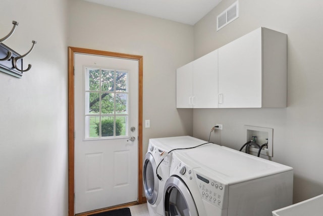 548 Asbury Dr, Aurora, IL 60502 - washroom with cabinet space and washing machine and clothes dryer