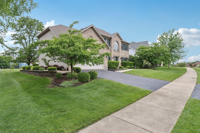 548 Asbury Dr, Aurora, IL 60502 - view of front facade with driveway and a front lawn