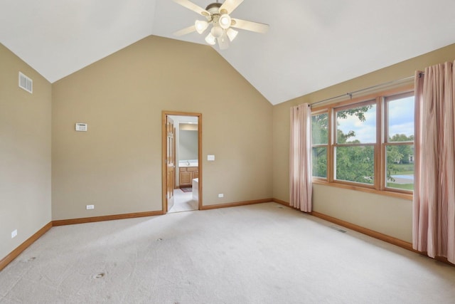 548 Asbury Dr, Aurora, IL 60502 - empty room with light carpet, ceiling fan, vaulted ceiling, and baseboards