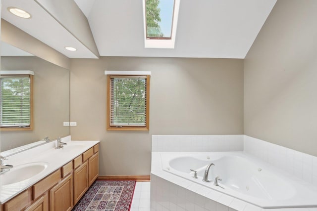 548 Asbury Dr, Aurora, IL 60502 - full bathroom featuring a skylight, double vanity, a whirlpool tub, healthy amount of natural light, and recessed lighting
