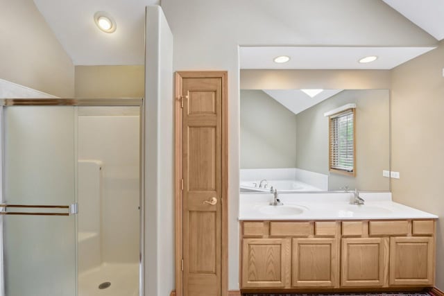548 Asbury Dr, Aurora, IL 60502 - bathroom featuring lofted ceiling, a skylight, a stall shower, a sink, and a garden tub