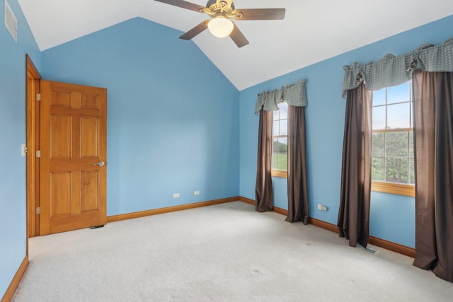 548 Asbury Dr, Aurora, IL 60502 - carpeted spare room featuring vaulted ceiling, ceiling fan, and baseboards