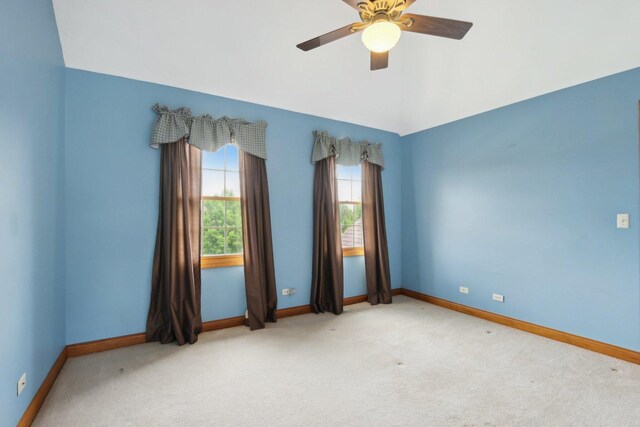 548 Asbury Dr, Aurora, IL 60502 - empty room featuring carpet flooring, baseboards, ceiling fan, and lofted ceiling