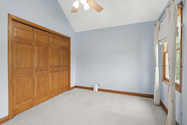 548 Asbury Dr, Aurora, IL 60502 - unfurnished bedroom featuring lofted ceiling, carpet, baseboards, a closet, and ceiling fan