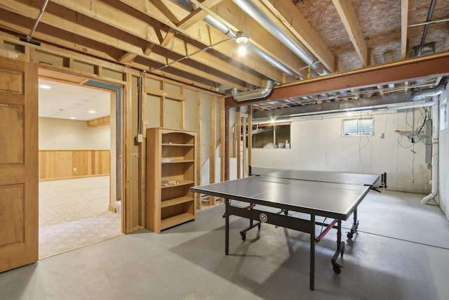 548 Asbury Dr, Aurora, IL 60502 - game room featuring concrete flooring and wooden walls