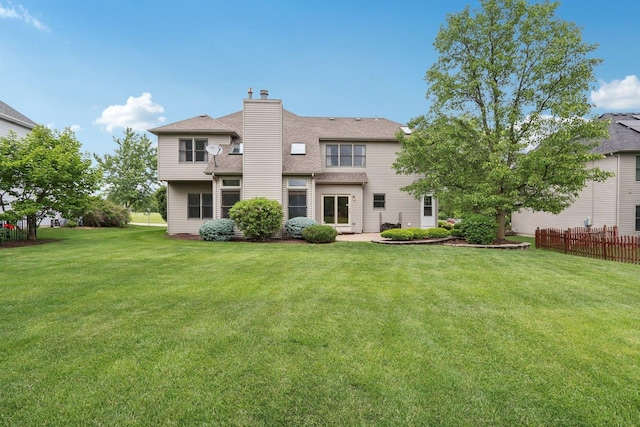 548 Asbury Dr, Aurora, IL 60502 - rear view of property featuring a chimney and roof with shingles
