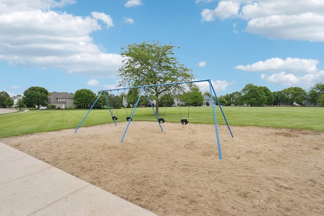 548 Asbury Dr, Aurora, IL 60502 - view of home's community with a lawn