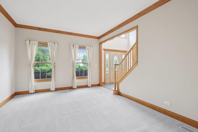 548 Asbury Dr, Aurora, IL 60502 - unfurnished room with baseboards, crown molding, carpet, and stairs
