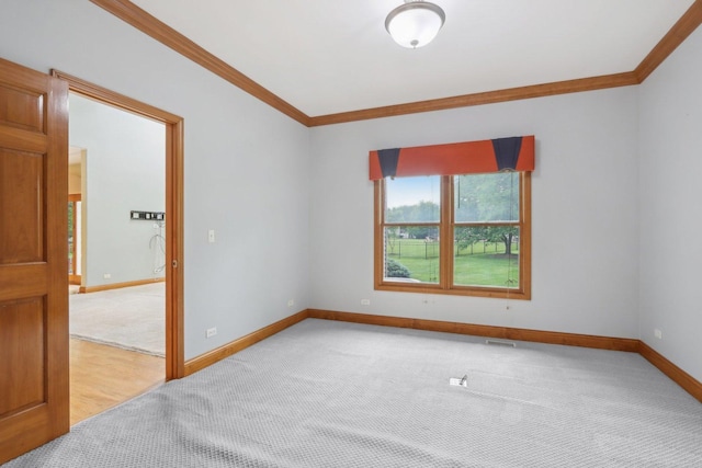 548 Asbury Dr, Aurora, IL 60502 - unfurnished room with crown molding, light carpet, and baseboards