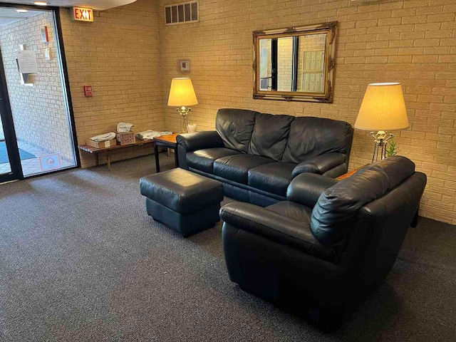 900 S River Rd Unit 3A, Des Plaines, IL 60016 - living room featuring carpet floors and brick wall